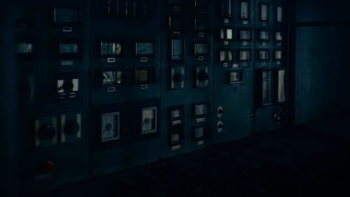 a room filled with lots of windows in a dark room
