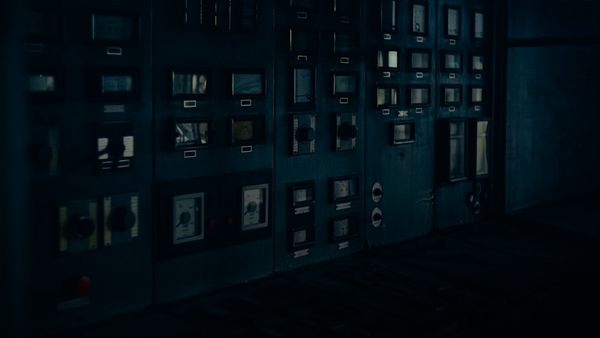 a room filled with lots of windows in a dark room