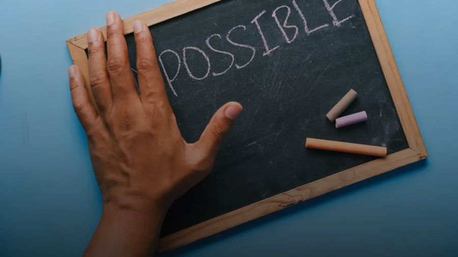 a chalkboard with the word possible written on it